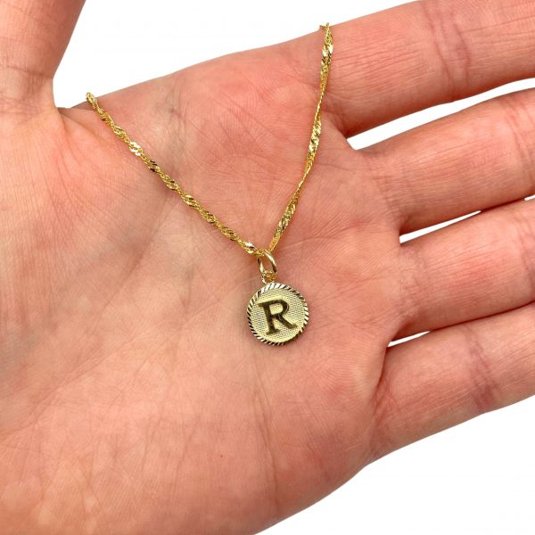 Gold necklace with round initial pendant top